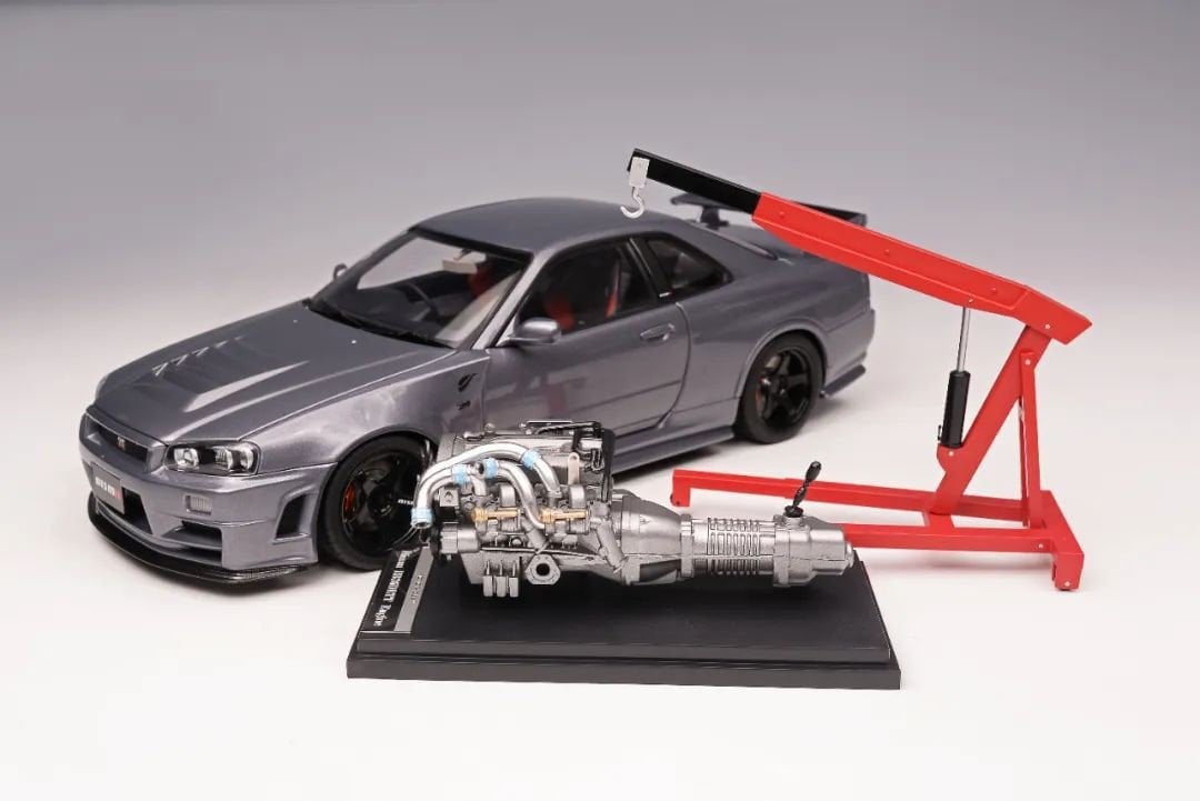 MOTORHELIX NISSAN SKYLINE GT-R (R34) NISMO CRS VER. GUN METALLIC 1:18 (M83409)